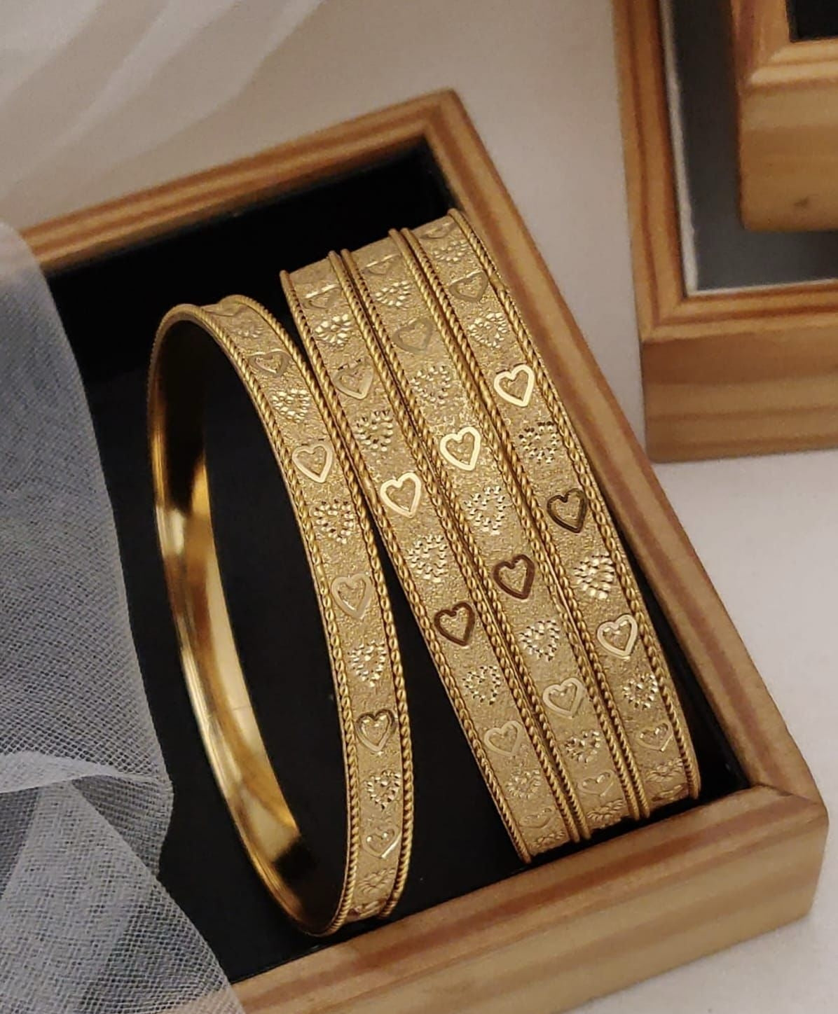Gold Plated Alloy Or Brass Bangles Featuring Intricate Geometric And Heart Shaped Engravings