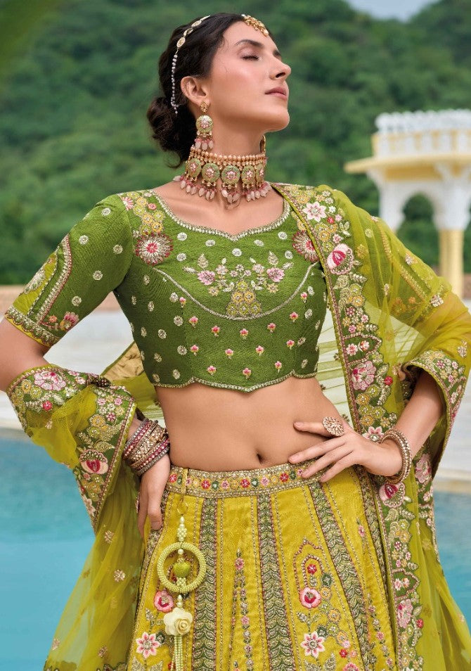 Lovely Yellow And Green Silk Bridal Lehenga With Embroidery Work