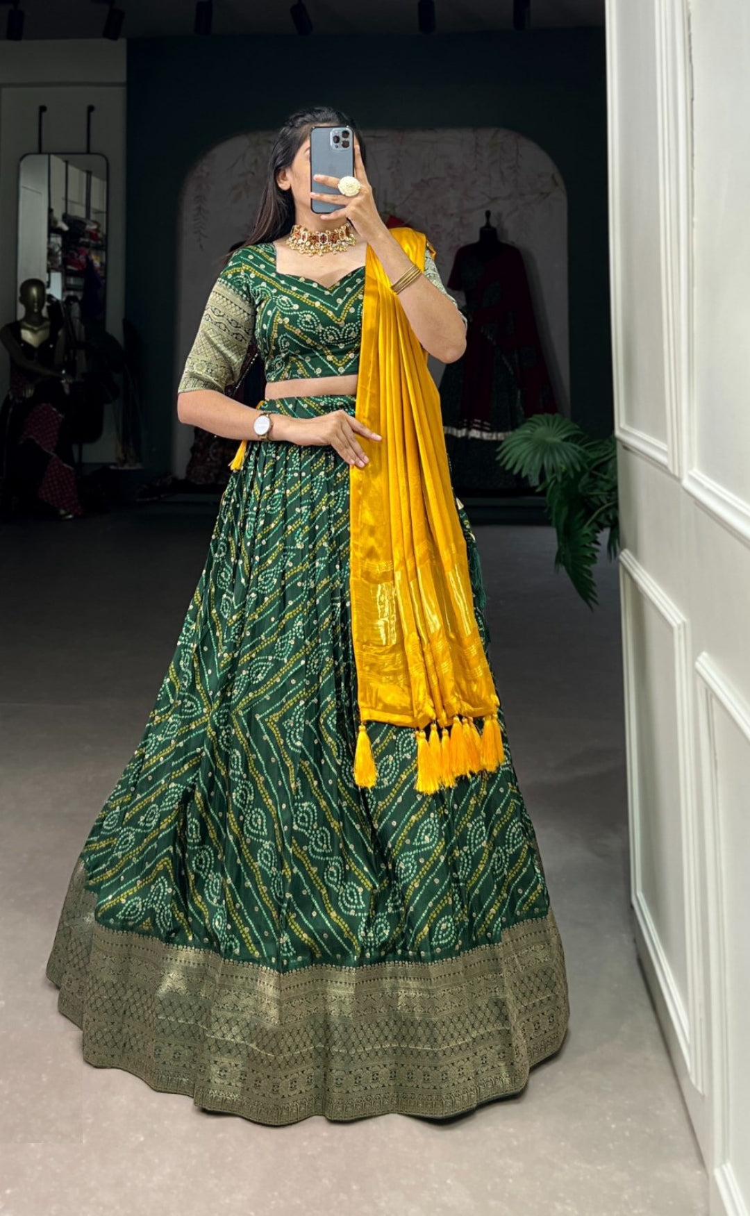 Gleaming Dark Green Viscose Dola Silk With Zari Weaving Printed Bandhani Lehenga