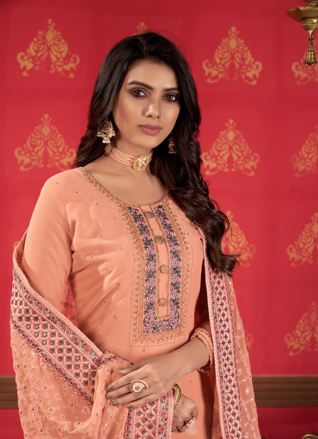 Flattering Peach Faux Georgette Gharara Bottom Suit Set