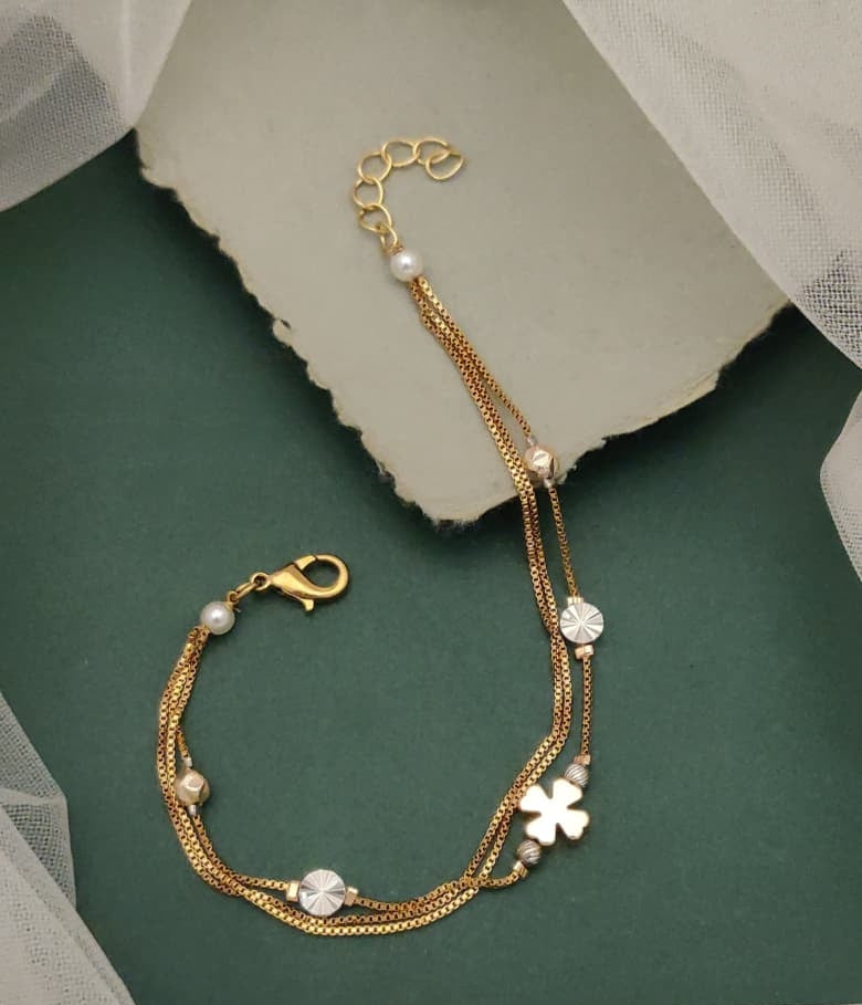 Regal Jewels Gold Plated Multi Strand Charm Bracelet Featuring Clover Motifs And Faux Pearls