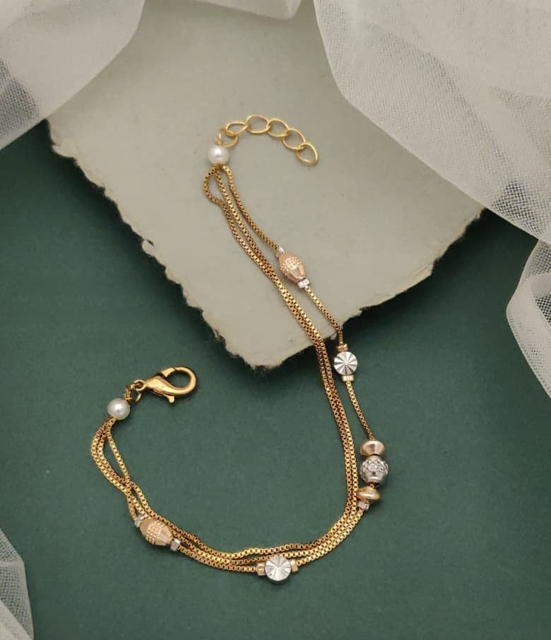 Eyes Blings Gold Plated Multi Strand Charm Bracelet Featuring Clover Motifs And Faux Pearls