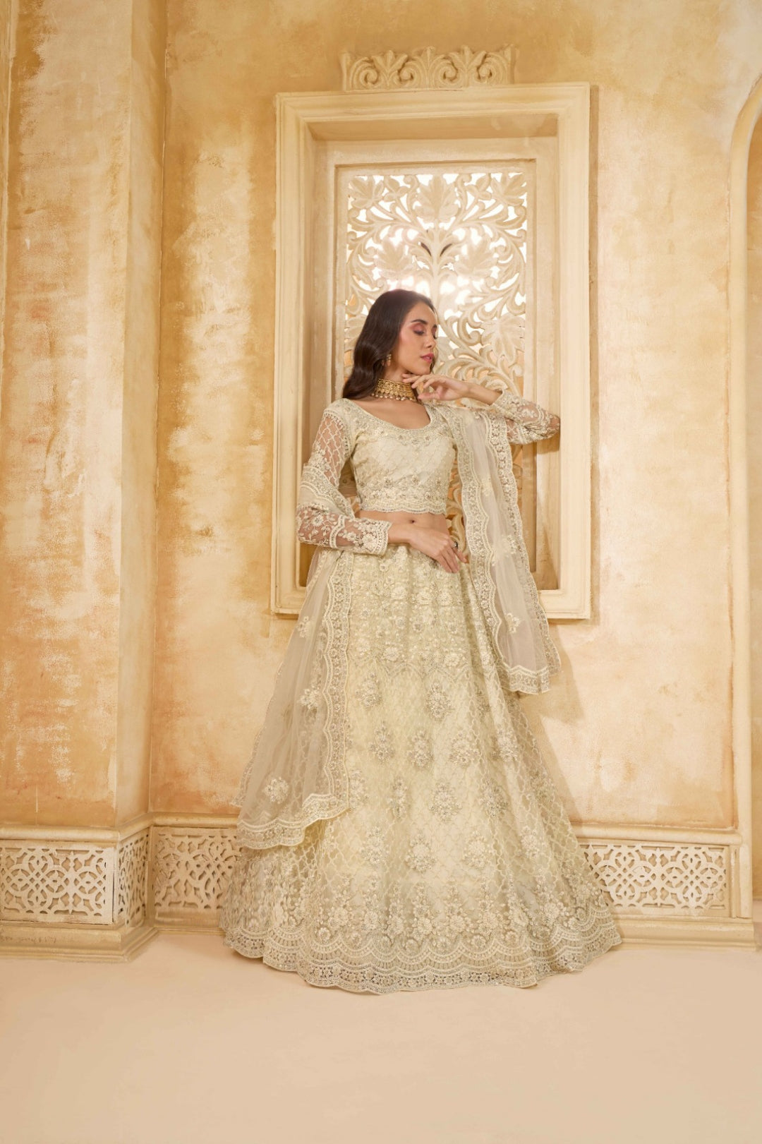 Luxurious Off White Net With Embroidery Work Gliterring Lehenga