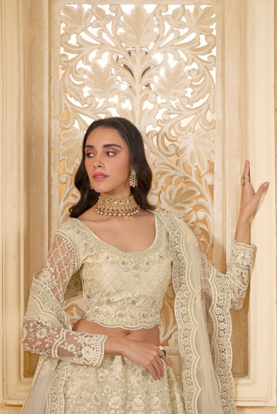 Luxurious Off White Net With Embroidery Work Gliterring Lehenga