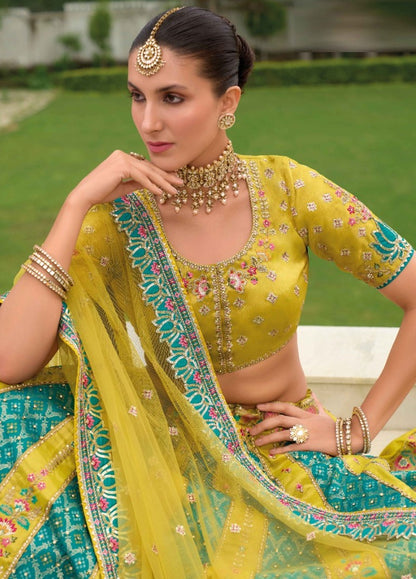 Women Yellow And Blue Silk Bridal Lehenga With Embroidery Work