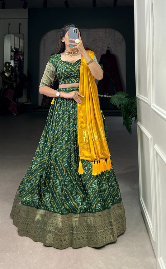 Gleaming Dark Green Viscose Dola Silk With Zari Weaving Printed Bandhani Lehenga