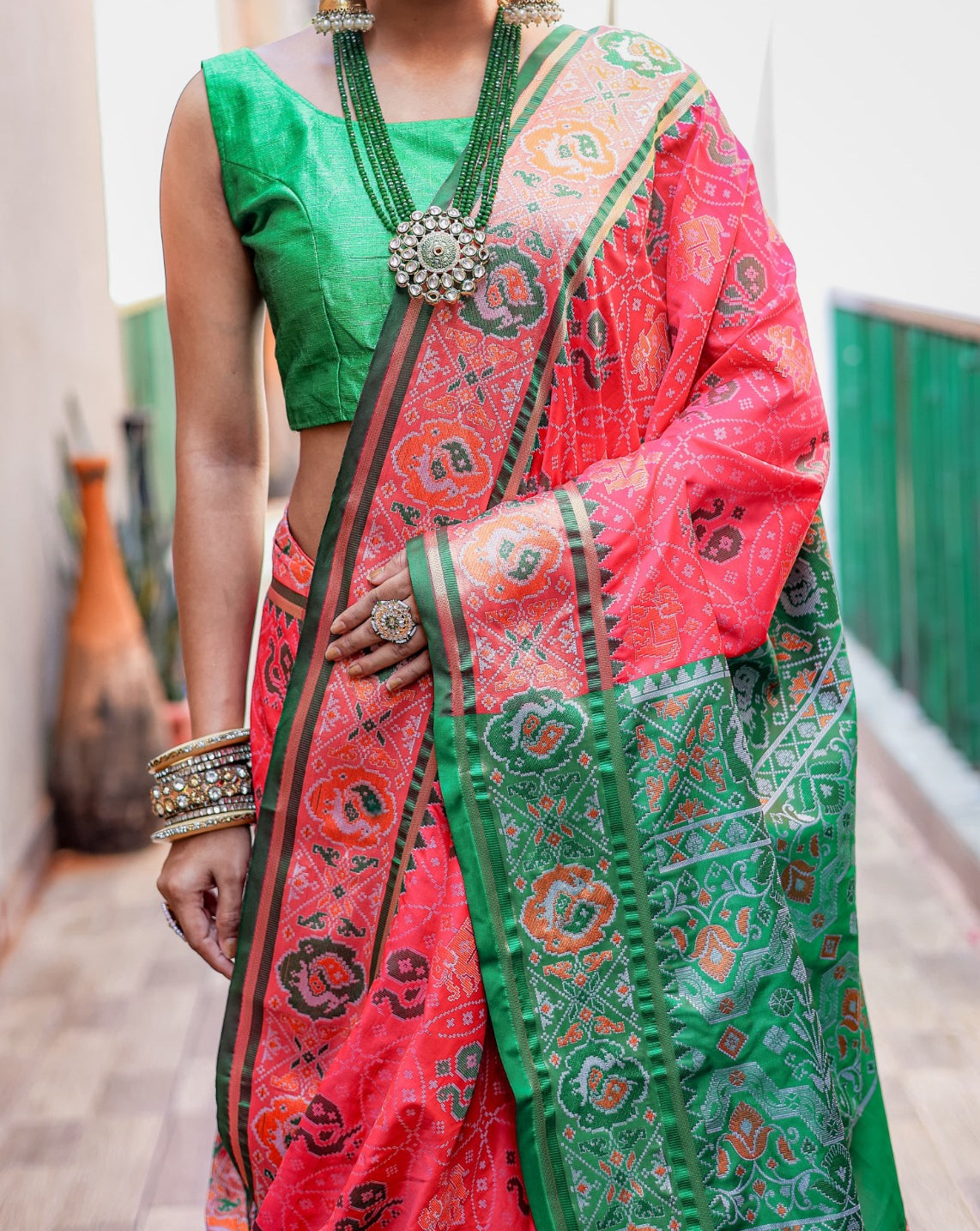 Women Coral And Green Patola Silk Saree