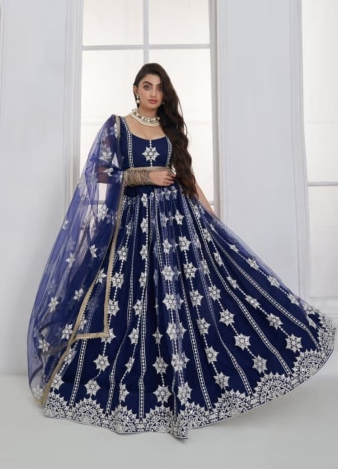 Exquisit Navy Blue Net With Embroidery Work Stylish Lehenga