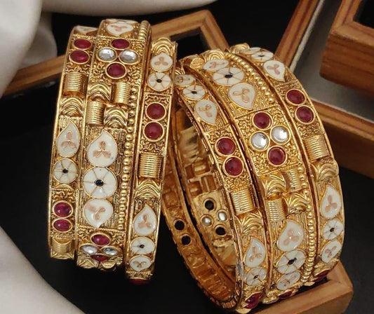 Elegante Gold Plated Brass Bangle Set Featuring Intricate Featuring And Studded Stones
