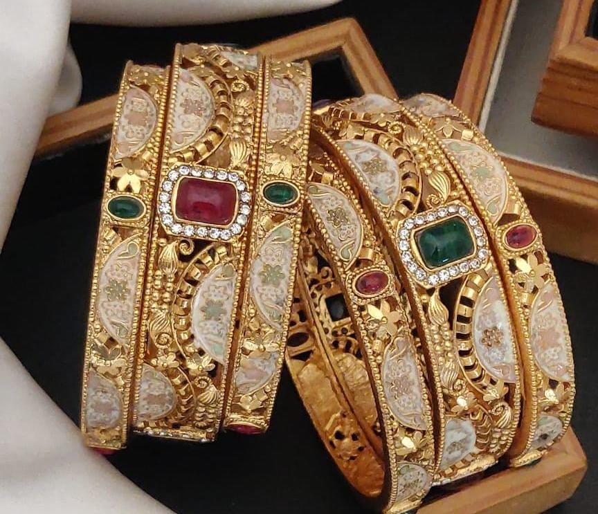 Royal Radiance Gold Plated Brass Bangle Set Featuring Intricate Featuring And Studded Stones