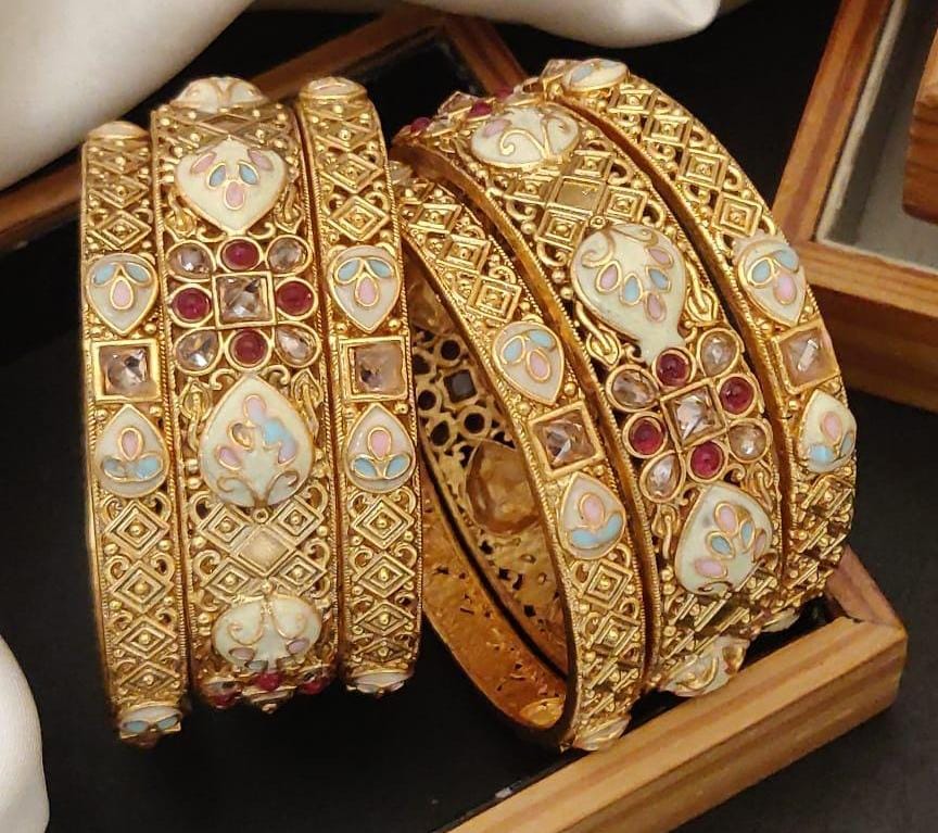 Noble Nacre Gold Plated Brass Bangle Set Featuring Intricate Featuring And Studded Stones