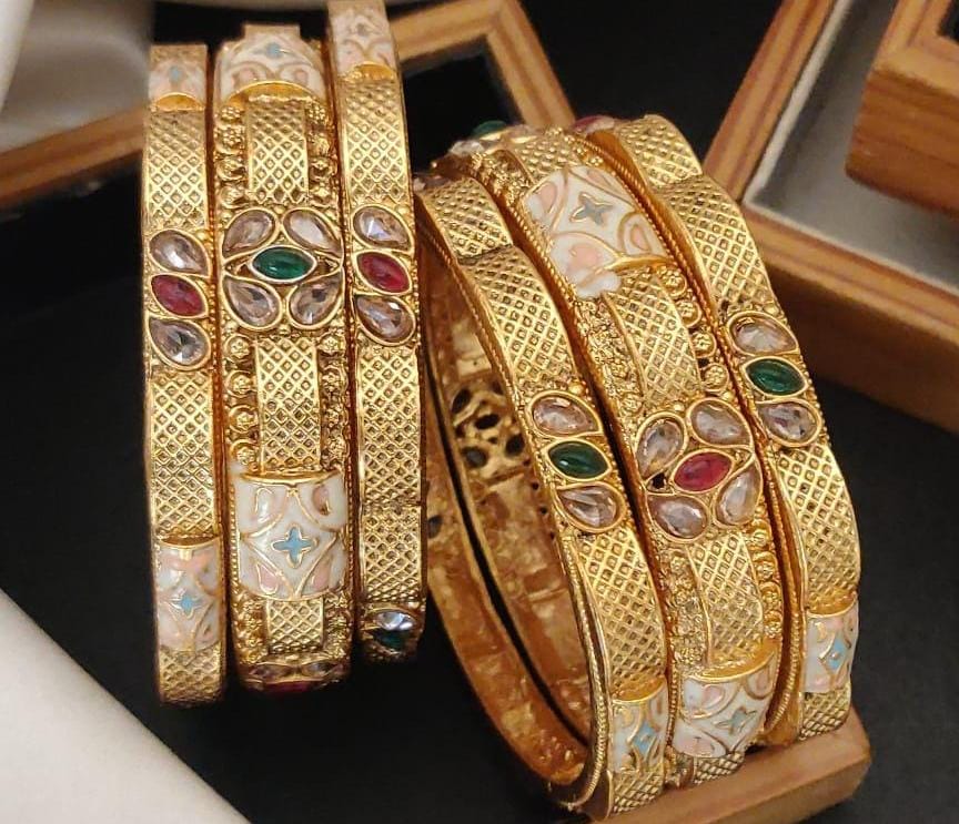 Awristocrat Gold Plated Brass Bangle Set Featuring Intricate Featuring And Studded Stones