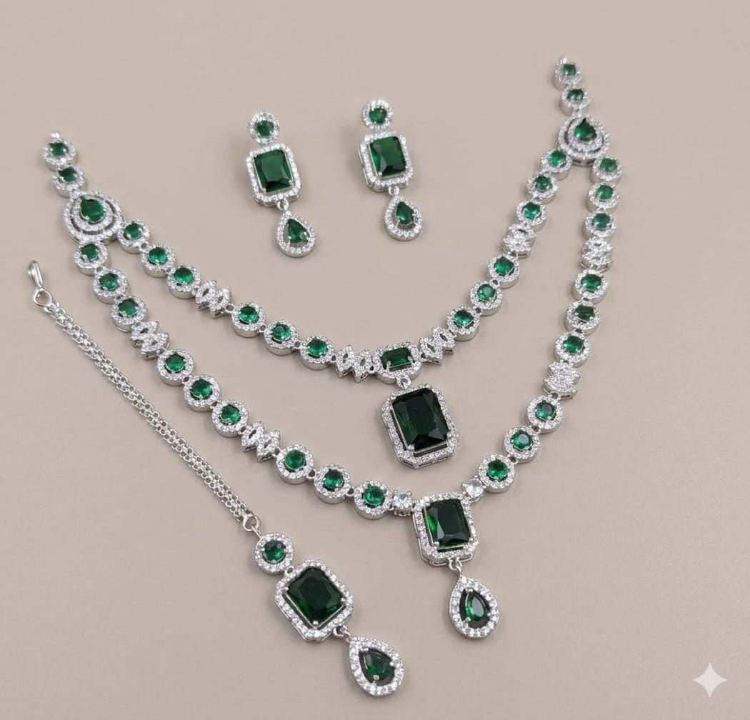 Silver Plated American Diamond Studded Jewelry Set Featuring Green Stones And Matching Earrings