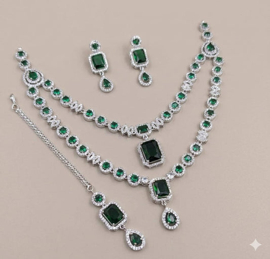 Silver Plated American Diamond Studded Jewelry Set Featuring Green Stones And Matching Earrings