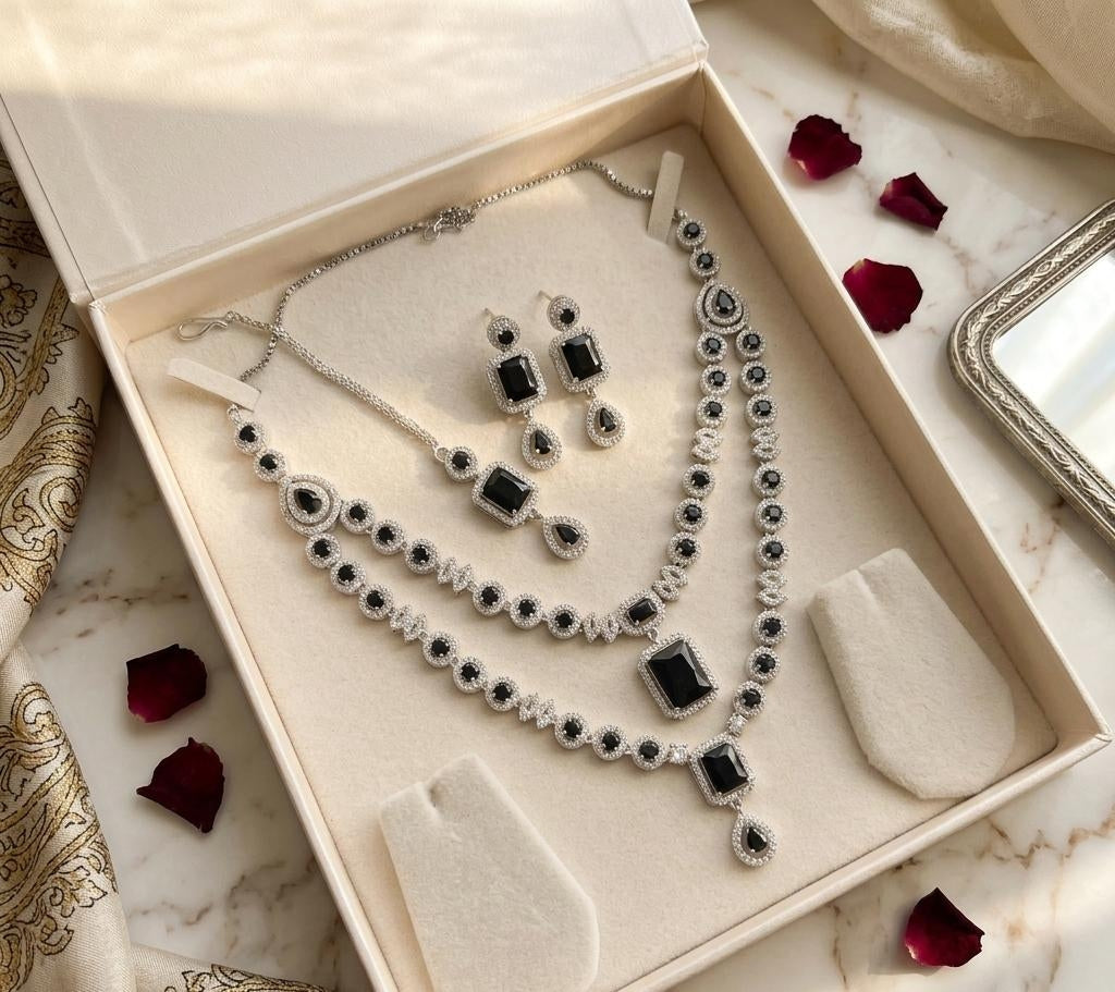 Silver Plated American Diamond Studded Jewelry Set Featuring Black Stones And Matching Earrings