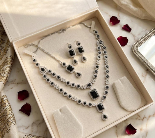 Silver Plated American Diamond Studded Jewelry Set Featuring Black Stones And Matching Earrings