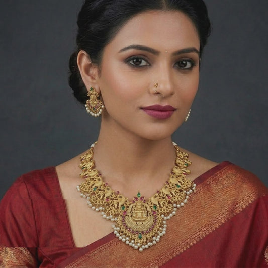 Gold Plated Temple Jewellery Necklace Set Featuring Goddess Lakshmi Motifs