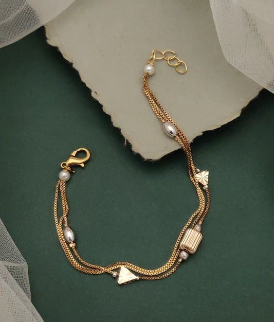 Grace Collection Gold Plated Multi Strand Charm Bracelet Featuring Clover Motifs And Faux Pearls