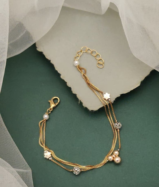 Royal Reflections Gold Plated Multi Strand Charm Bracelet Featuring Clover Motifs And Faux Pearls